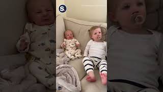 Baby Tries To Be Brave After Being Socked In The Nose By Big Sis