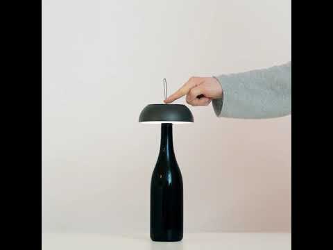 A portable, wireless, versatile lamp