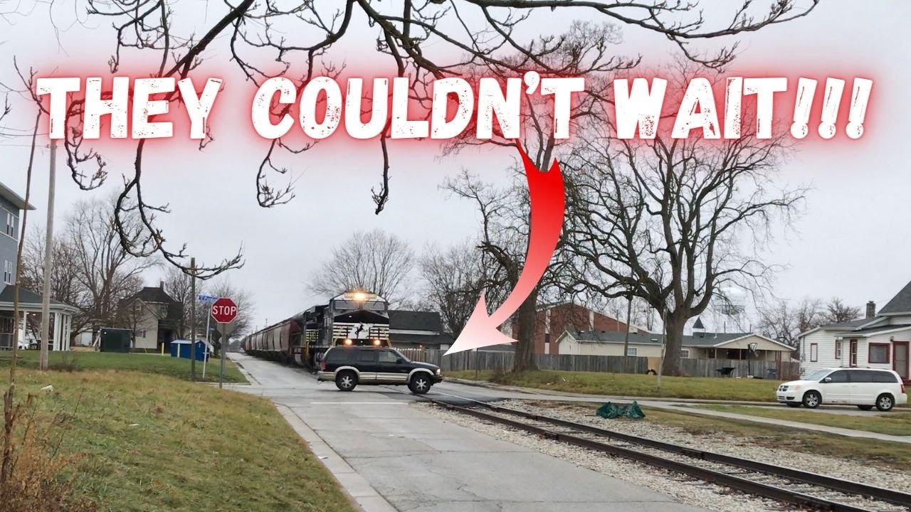 Truck races over crossing in front of loaded grain train!!! Train over 2 miles long starts moving at