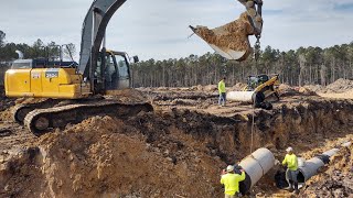 Laying 24' Concrete Pipe For Storm Drainage