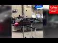 RAW VIDEO: Police Seen Detaining Man After Vehicle Drives Into Detroit Airport Check-In Counter
