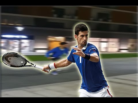Novak Djokovic playing tennis in front of his building with kids
