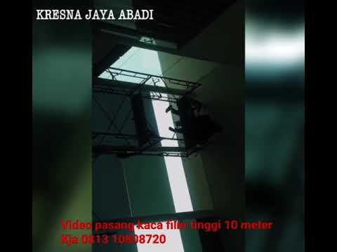 PROSES PEMASANGAN  KACA  FILM GEDUNG  KRESNA JAYA ABADI 