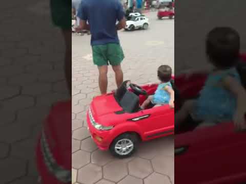 Baby girl sitting on the car