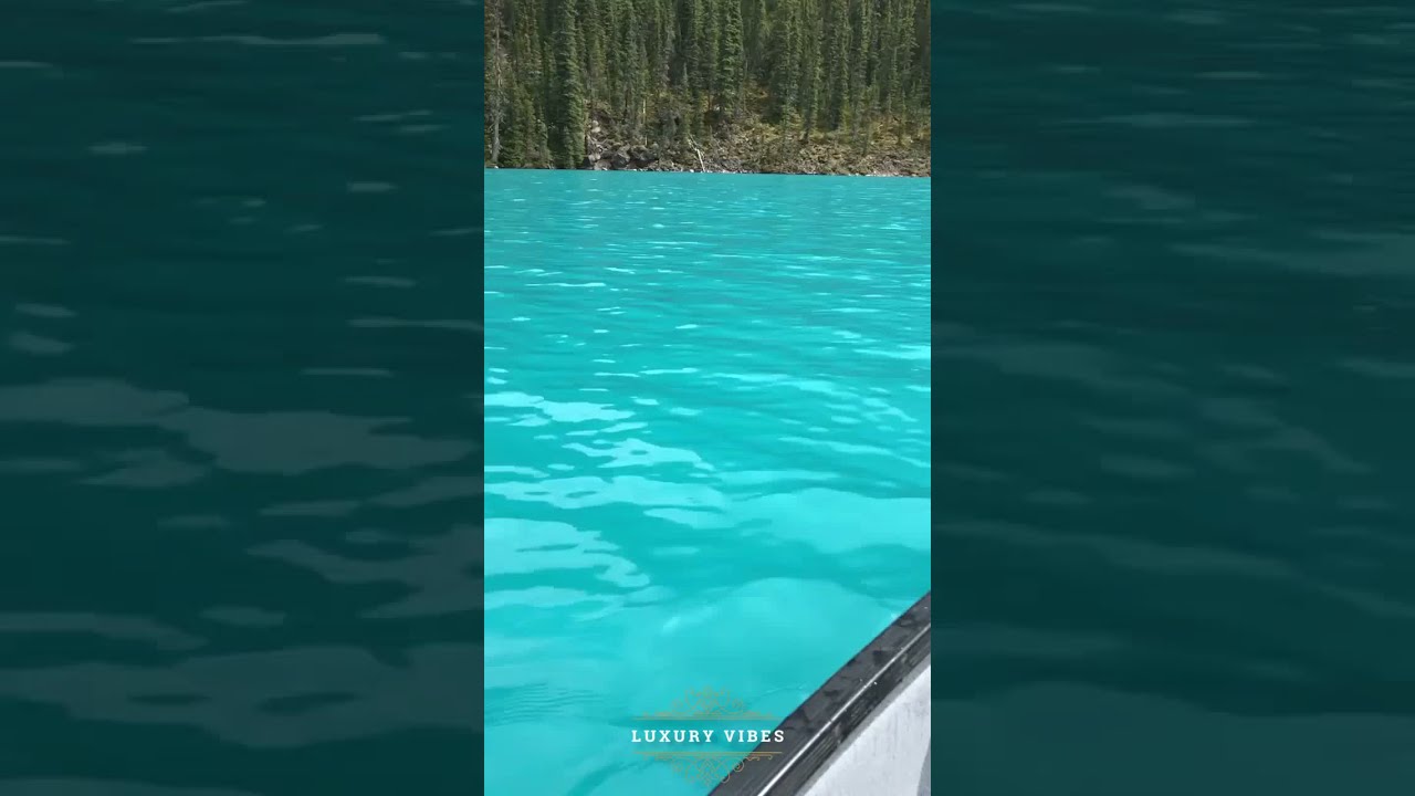 On A Canoe From My Eyes Marveling At The Vivid Turquoise Waters And Awe Inspiring Mountains Shorts