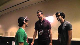 Dustin has a chat with two really tall guys.