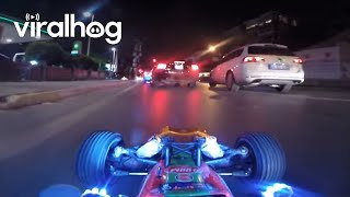 (contact licensing@viralhog.com for licensing/usage info.) the remote
control car is being driven from coming behind, alongside real
automobiles on a...