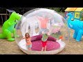 Katy and Max play with their Clear ball playhouse