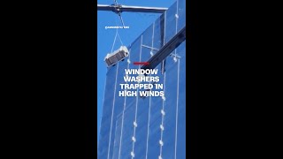 Window washers trapped in high winds