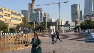 Relatives of Hamas hostages run for cover as sirens sound in Tel Aviv | AFP