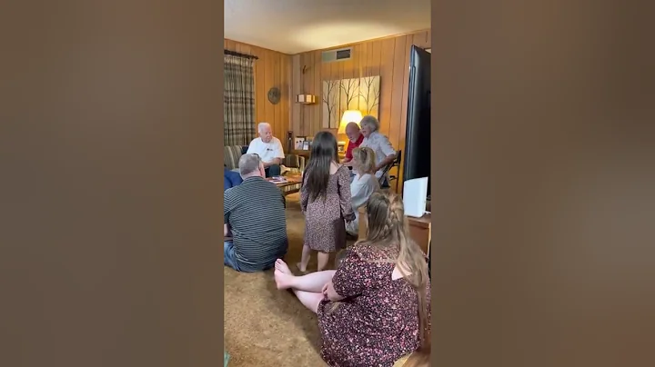 Family gathering, reminiscing on the old days. Nea...