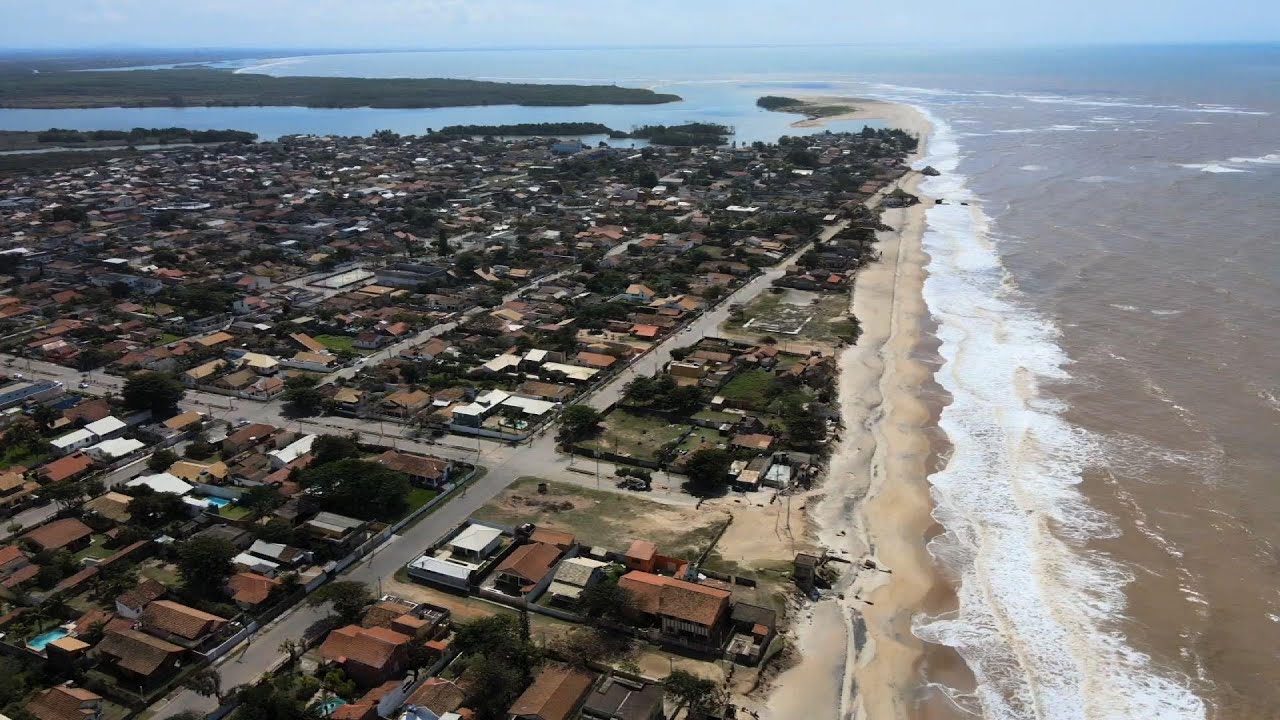 Rising sea levels drown community in Brazil - YouTube