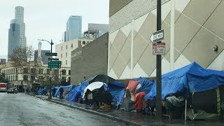 Drive through skid row, los angeles california' row is an area of
downtown containing one the largest homeless population in united s...