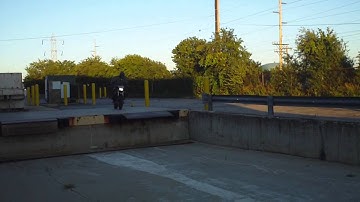 DRZ 400 sm  jumping down a loading dock supermoto
