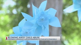Blue pinwheels placed around Tyler symbolizing child abuse awareness, prevention