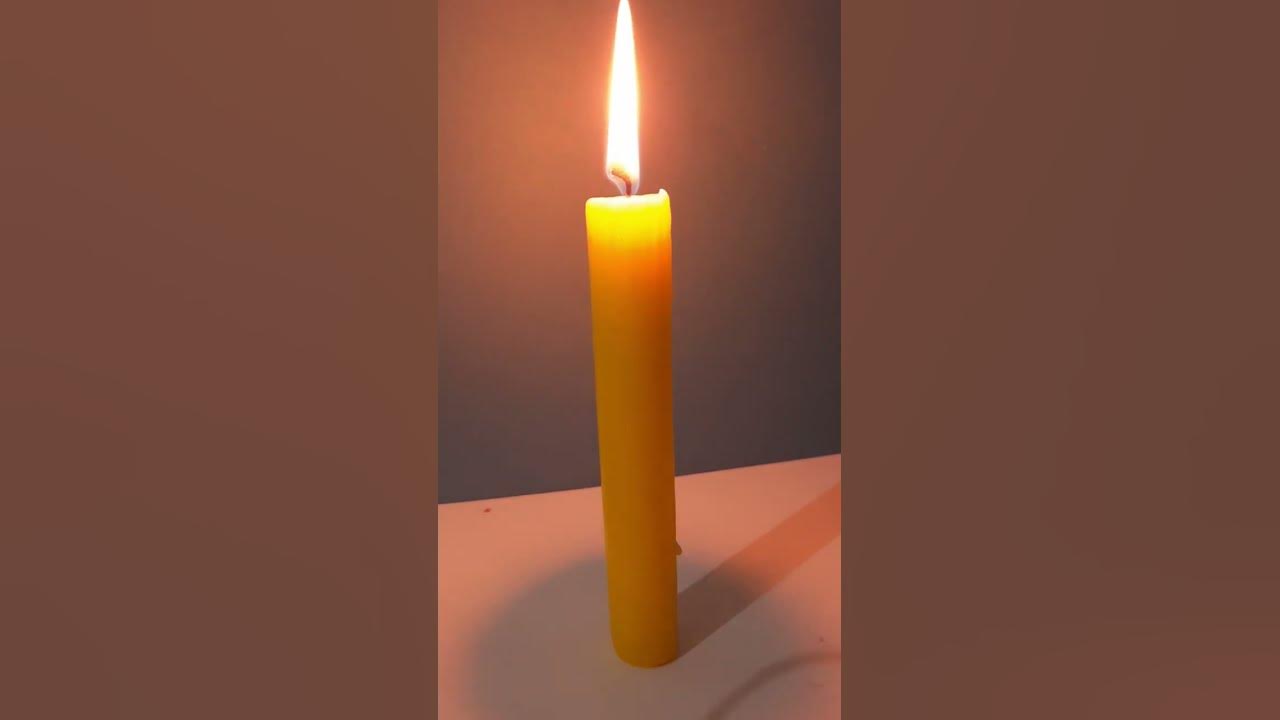 yellow candle burning | candle melting