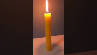 yellow candle burning | candle melting