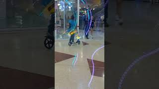 Woman Riding Scooter Inside Mall Falls Backwards - 1478607