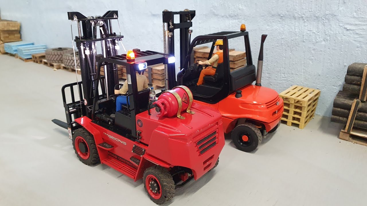 RC tracked bobcat and 2 Forklifts.