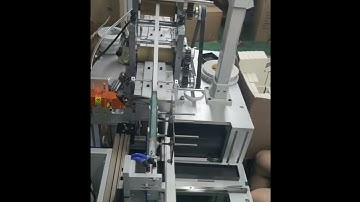 Automatic box ribbon band attaching machine