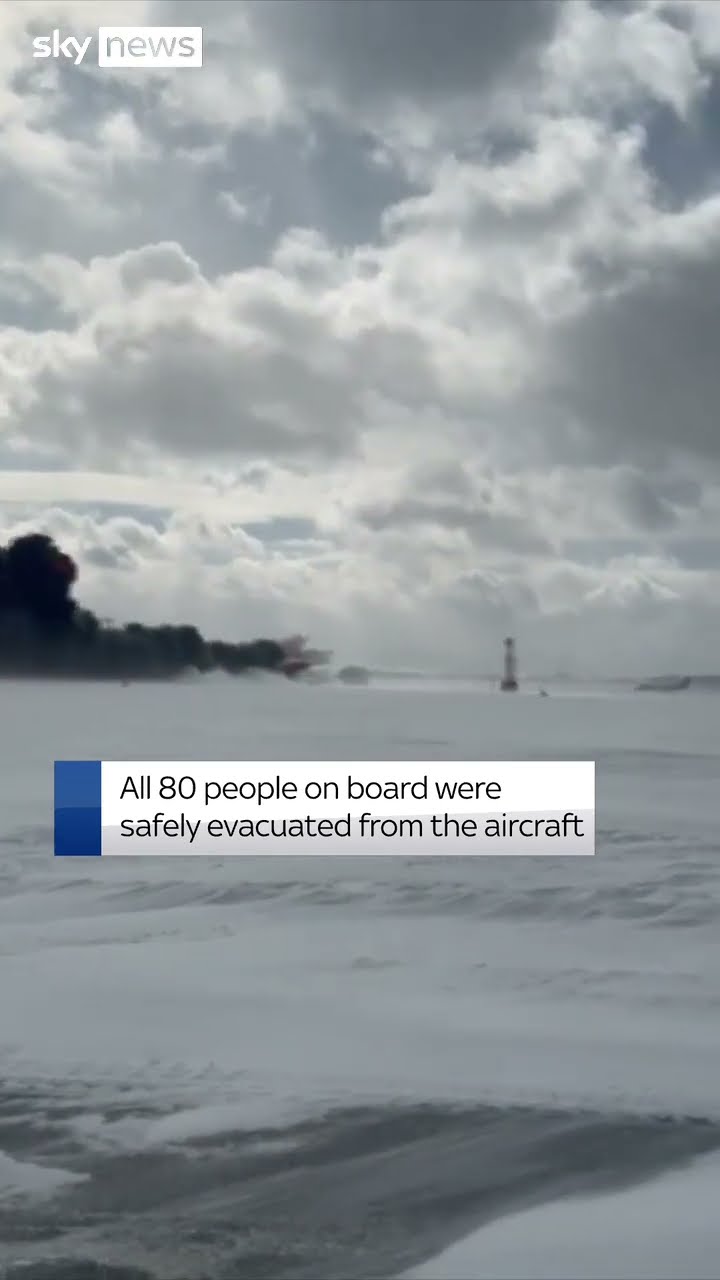 Watch moment plane flips over in Toronto