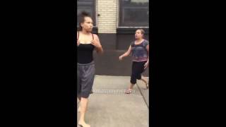 Two Women Go At It On The Block!