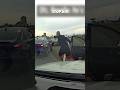 Suspect Clings To A Car Door Trying To Escape Police