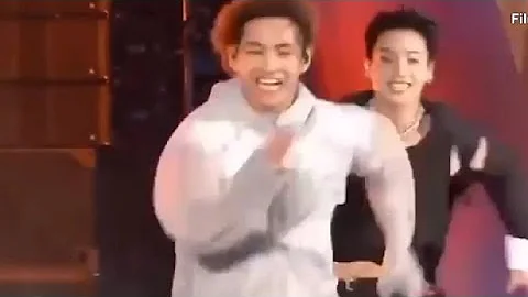 taekook chasing each other in muster concert. jk throwing water on V.