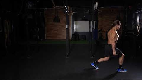 DB Suitcase Walking Lunge