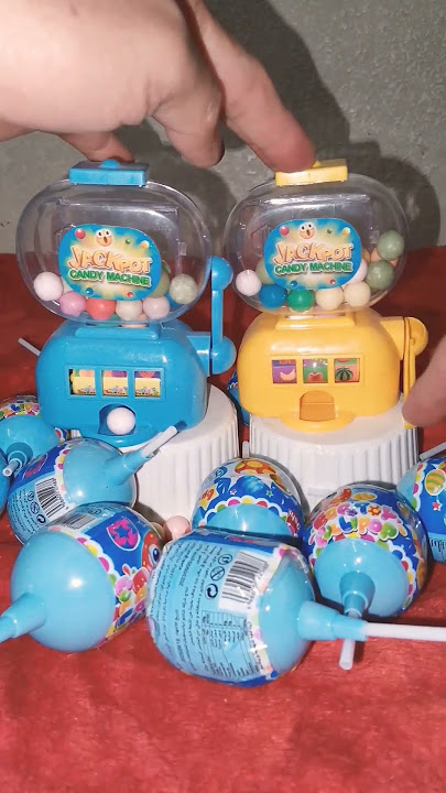 Blue and yellow jackpot candy machine dispenser with large egg toy lollipops #shorts