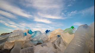 timelapse plastic bottles in a polluted clouds background
