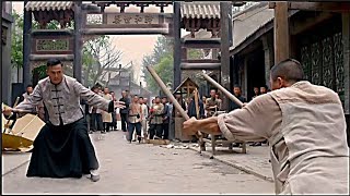 The bully kicked the old man in the street, angered the kung fu boy.