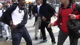 Plainclothes policeman interrupts an after school brawl in Downtown Brooklyn rather abruptly