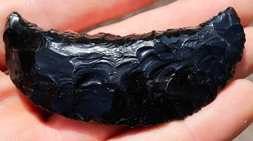 Flintknapping an Obsidian Crescent. Ancient Stone Age Tool.