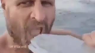 Random Russian man diving into Icy water and eat ice meme template
