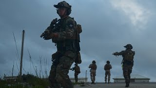 - marine raiders participate in exercise multi sail off the coast of
guam. they conduct parachute interdiction operations and a visit,
board, search seiz...