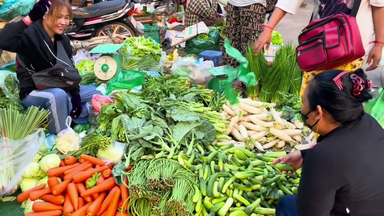 Lots of people come to buy vegetables, @Fish and meat at this market  Name of Market Leu Thom Th