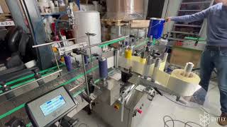 Onitex L200 Labeling Machine. Automatic Orientation and Lifting of the Conic Bucket’s Handle