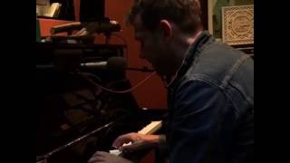 Damon Albarn playing the piano in studio with Kelela