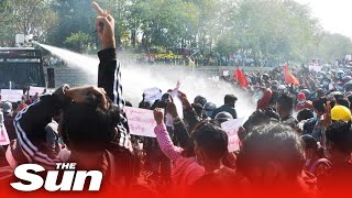 Myanmar police fire water cannons on anti-coup protesters
