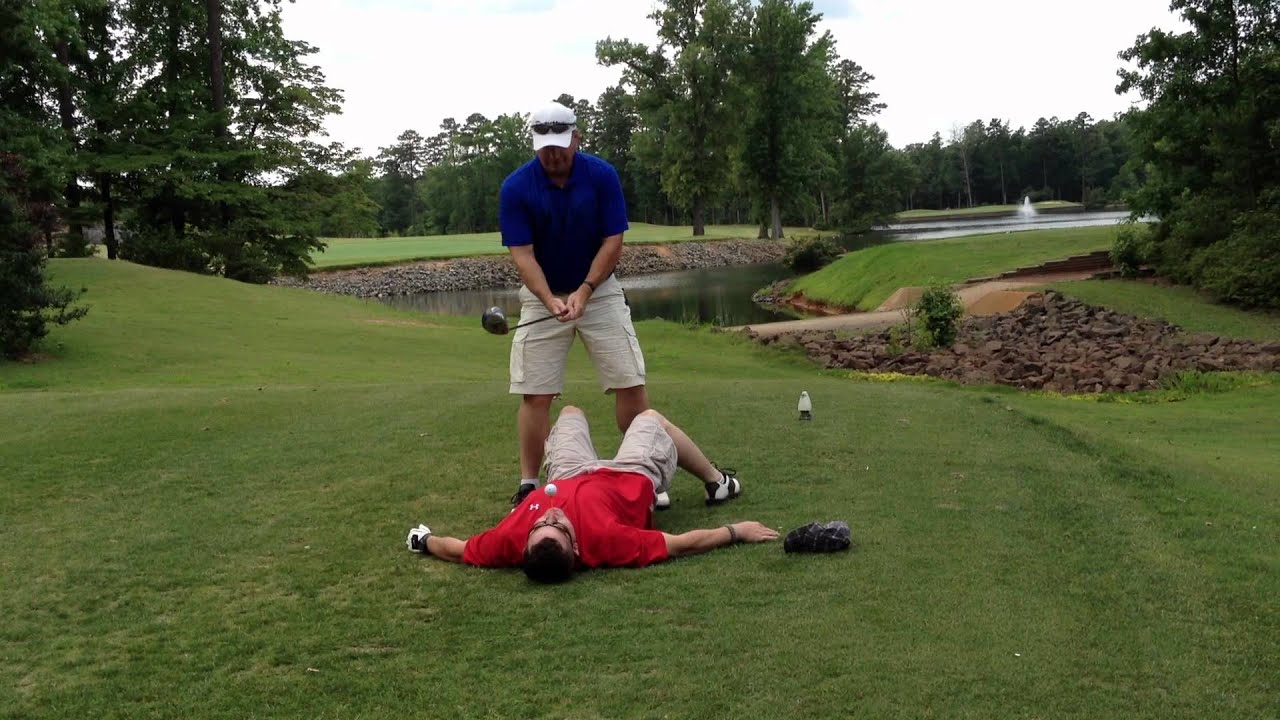 Trusting your fellow golfer!! Man hits golf ball from tee in mouth