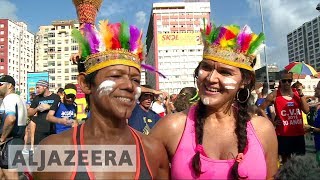 Brazilians are letting off steam as carnival season hits the streets.
their struggles with economy, corruption and political splits being
forgotten, ...