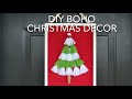 Boho Christmas Decor… using tassels and a dollar store wooden canvas