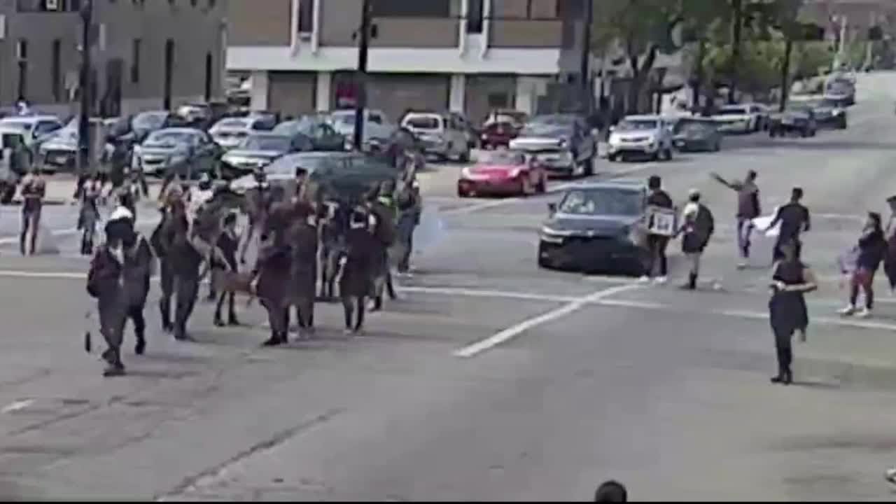 Car drives into crowd of protesters YouTube