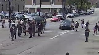 Car drives into crowd of protesters