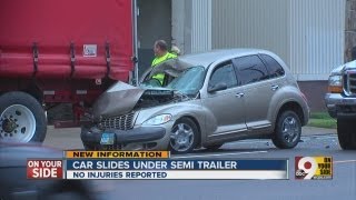 No injuries reported after car collides with semi