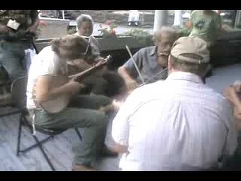 Players on Halliehurst porch at Augusta Heritage Center in Elkins, WV in August 2008, Oldtime Week. This select group of musicians include Master fiddler Paul David Smith of Pike County, Kentucky; Dave Bing, a well-known WV fiddler; Don Pedi of WV, a master of the mountain dulcimer; Anna Roberts-Gevalt, clawhammer banjoist from Vermont