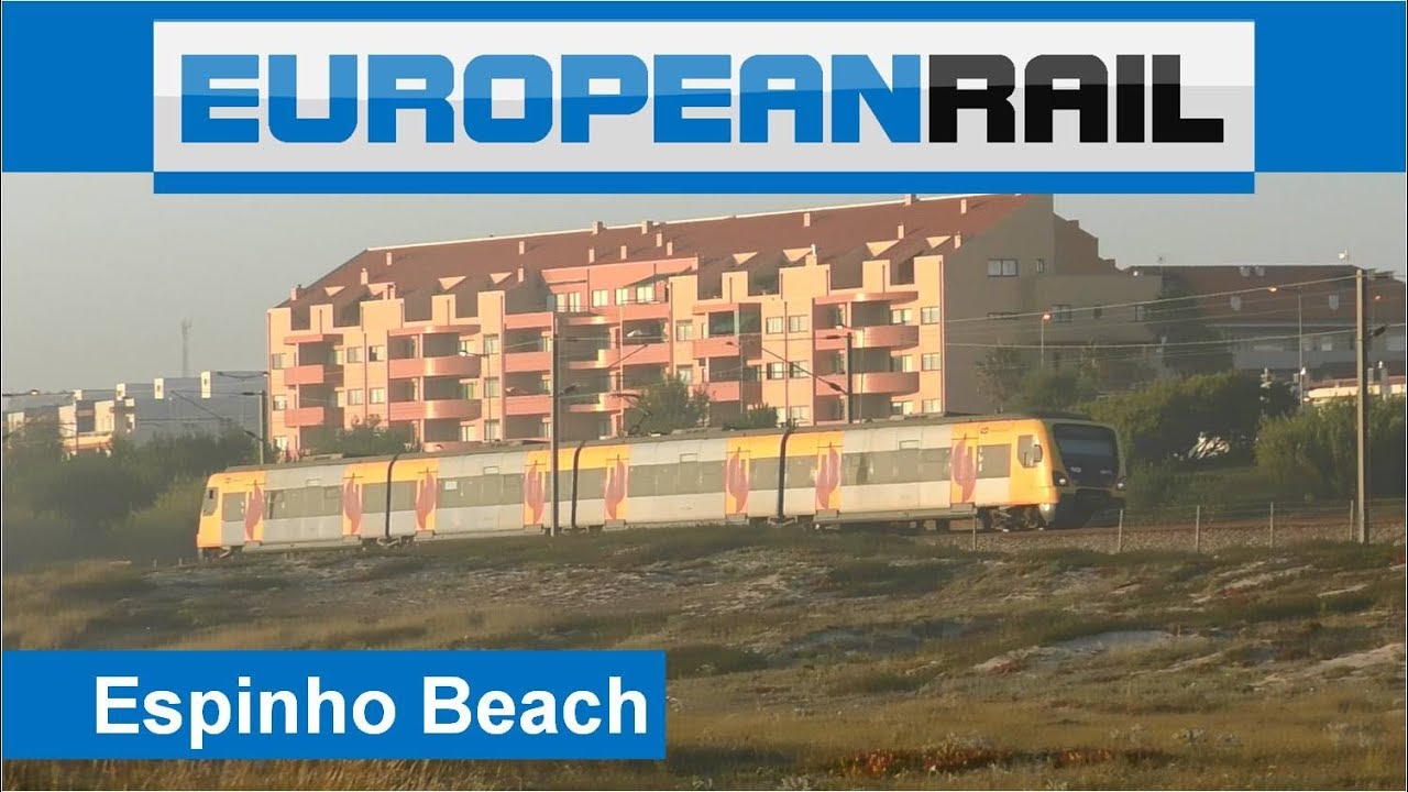Comboios de Portugal Series 3400 Train Suburbano passes Espinho Beach - Porto, Portugal