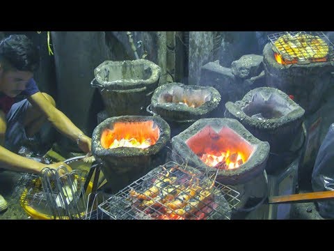 Bangkok Street Food. Seafood and Fish on Fire in Sukhumvit Soi 1, Thailand