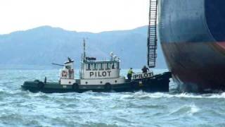 Columbia River, Astoria, Oregon.  Ship slips anchor.